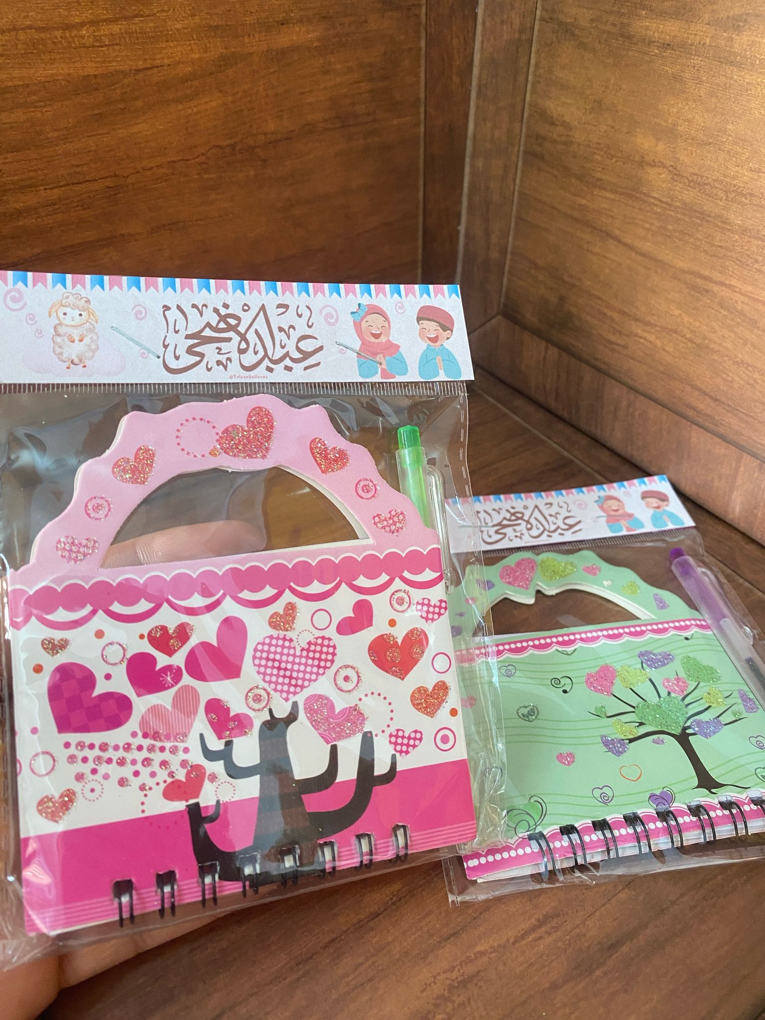 دفتر نوت مع قلم مع تغليف لعيد الأضحى