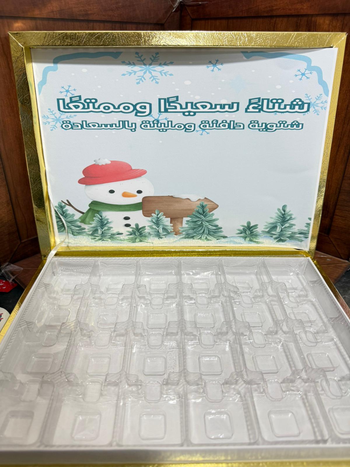 بوكس ذهبي شوكلاتة مع صورة لشتاء