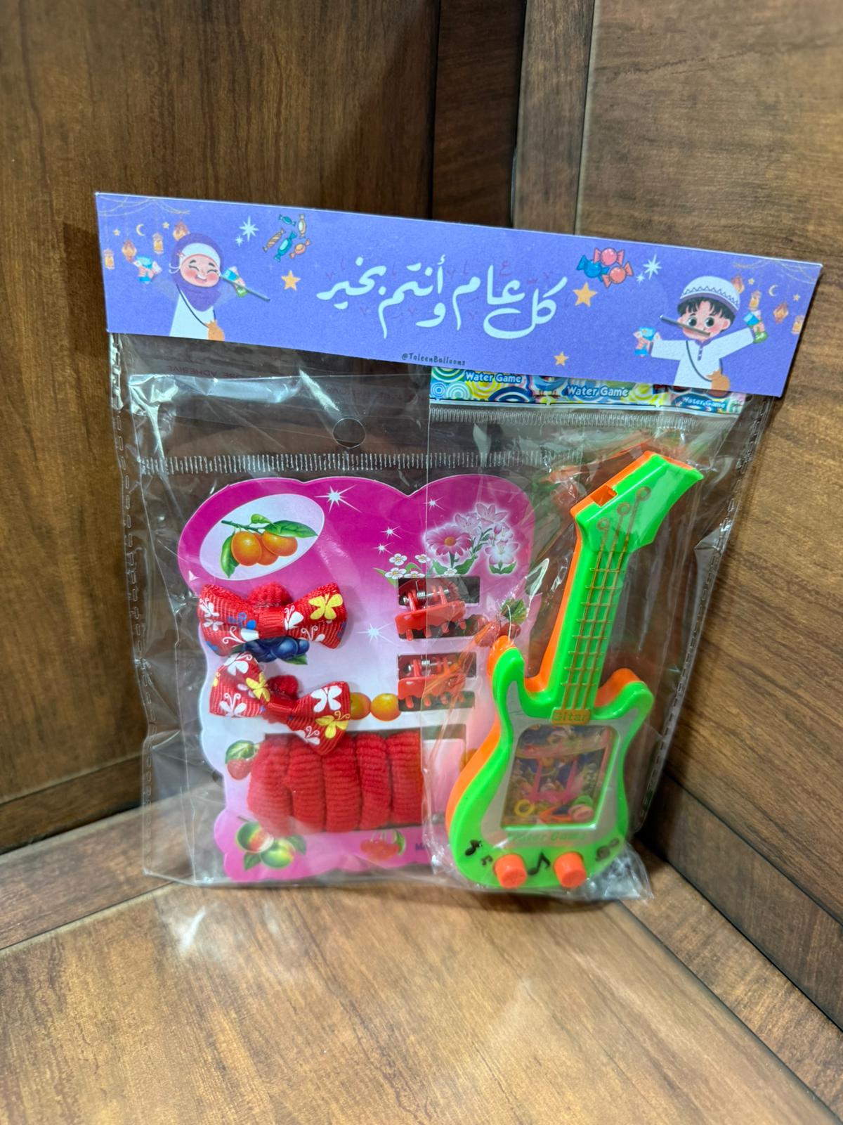 توزيعة ربطة شعر مع لعبة الماء مع تغليف لعيد الفطر